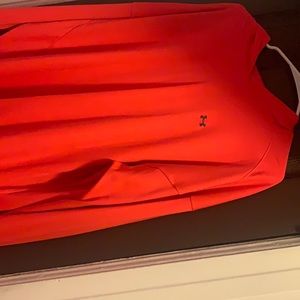 A pink under armor long sleeve Hooded shirt